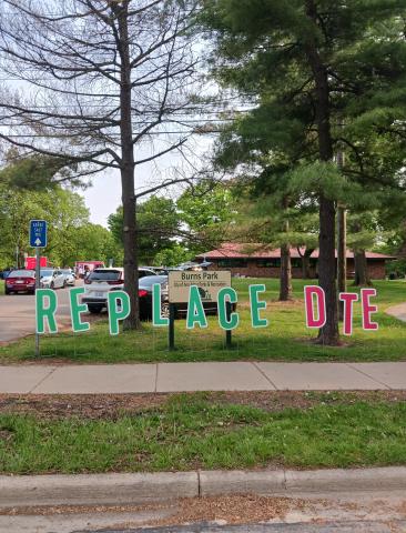 Cut out letters spelling "Replace DTE" at the 2023 Ann Arbor for Public Power Festival