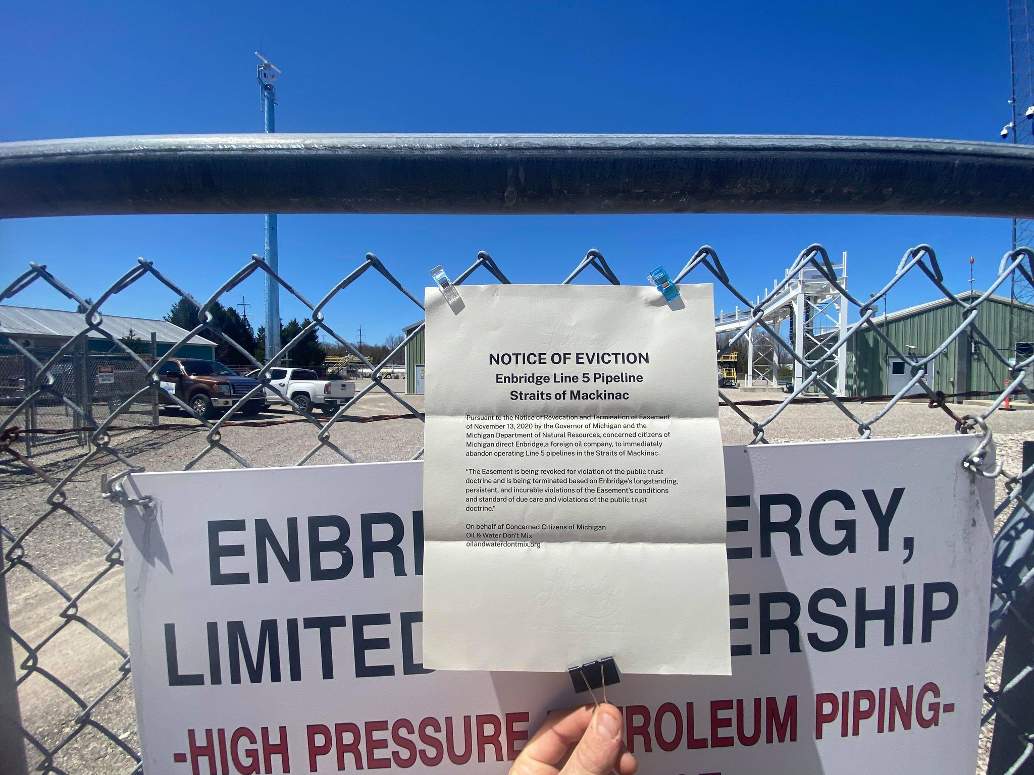 2021 Shut Down Line 5 Rally, Mackinaw City. Photo: Audrey Gerard Notice of Eviction hung on Enbridge fence
