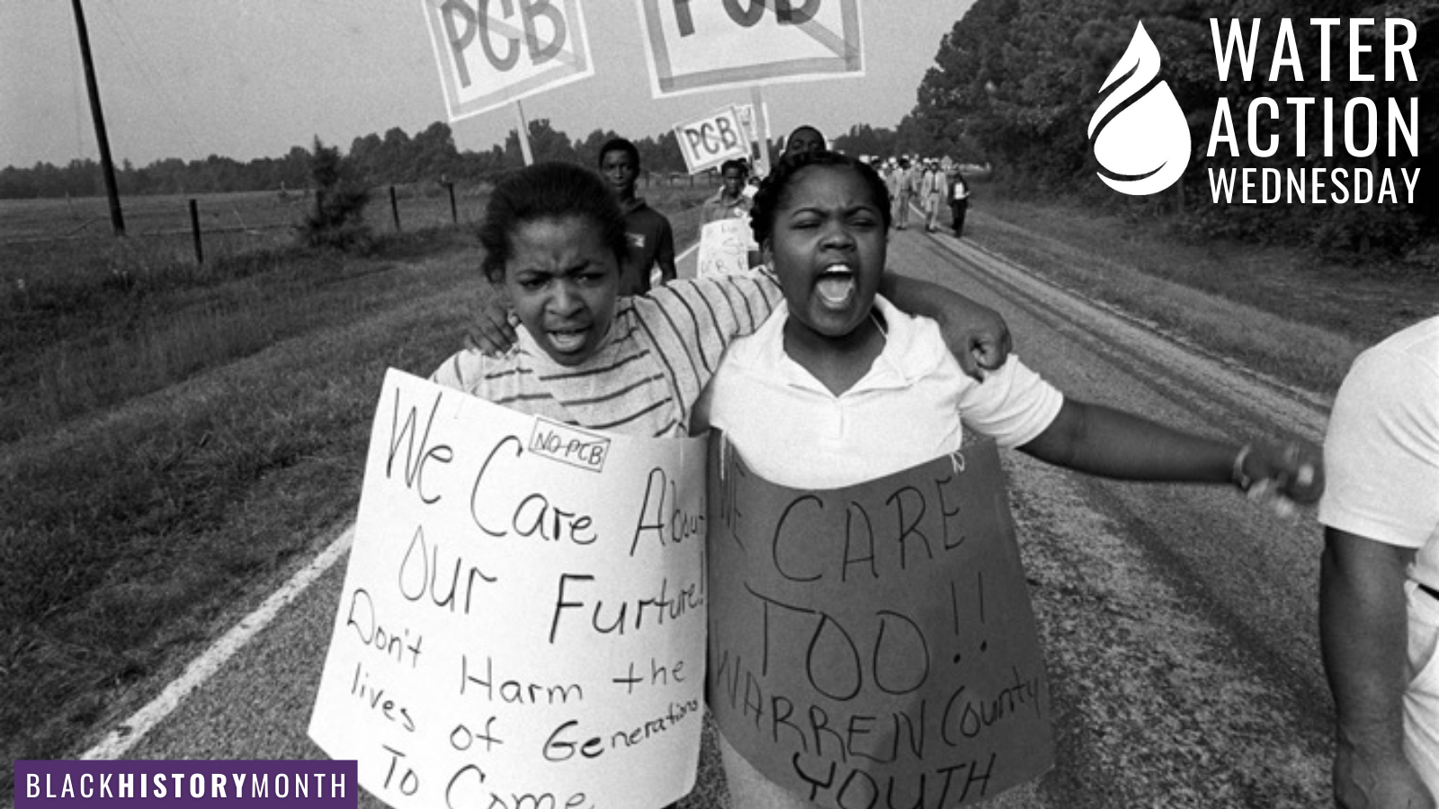 March and protest against in Warren, picture of two young Black girls with hadnmade signs "We Care About Our Future"