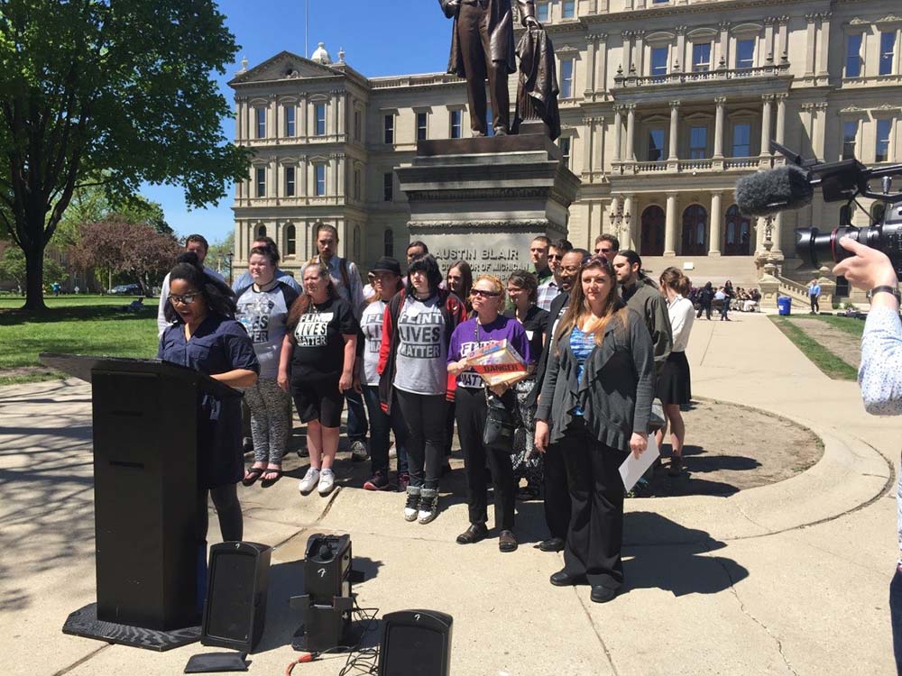 Nayyirah Shariff of Flint Rising addresses a press conference at the State Capitol on supplemental funding for Flint Nayyirah Shariff of Flint Rising addresses a press conference at the State Capitol on supplemental funding for Flint