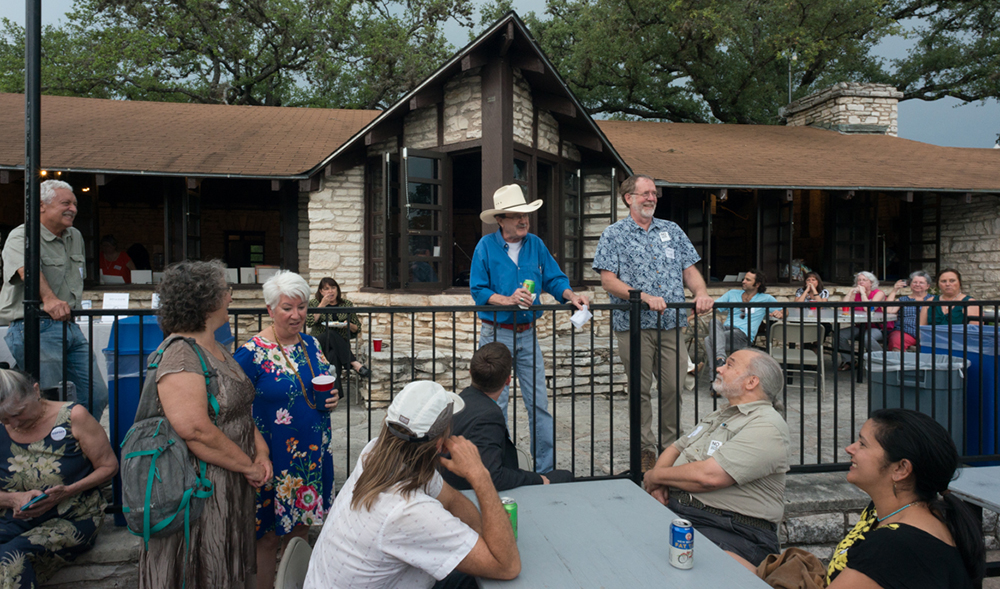 Jim Hightower and Texas Director David Foster address attendees.