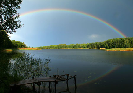 Rainbow over a lake. Photo credit: Viaceslav / Shutterstock