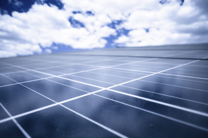 Solar panels, blue sky. Photo credit: epicurean / iStock