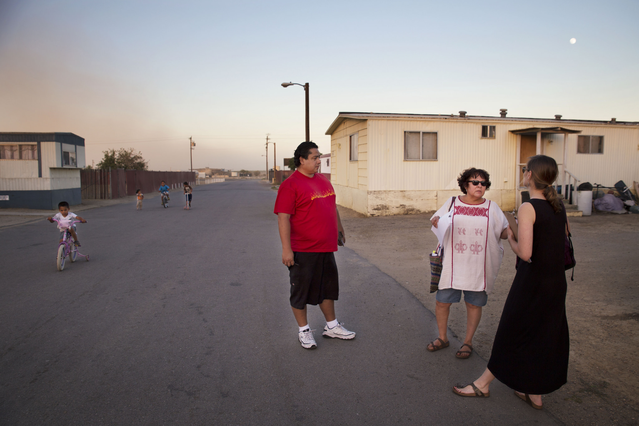 Rosanna Esparza (center) with residents in Kern County