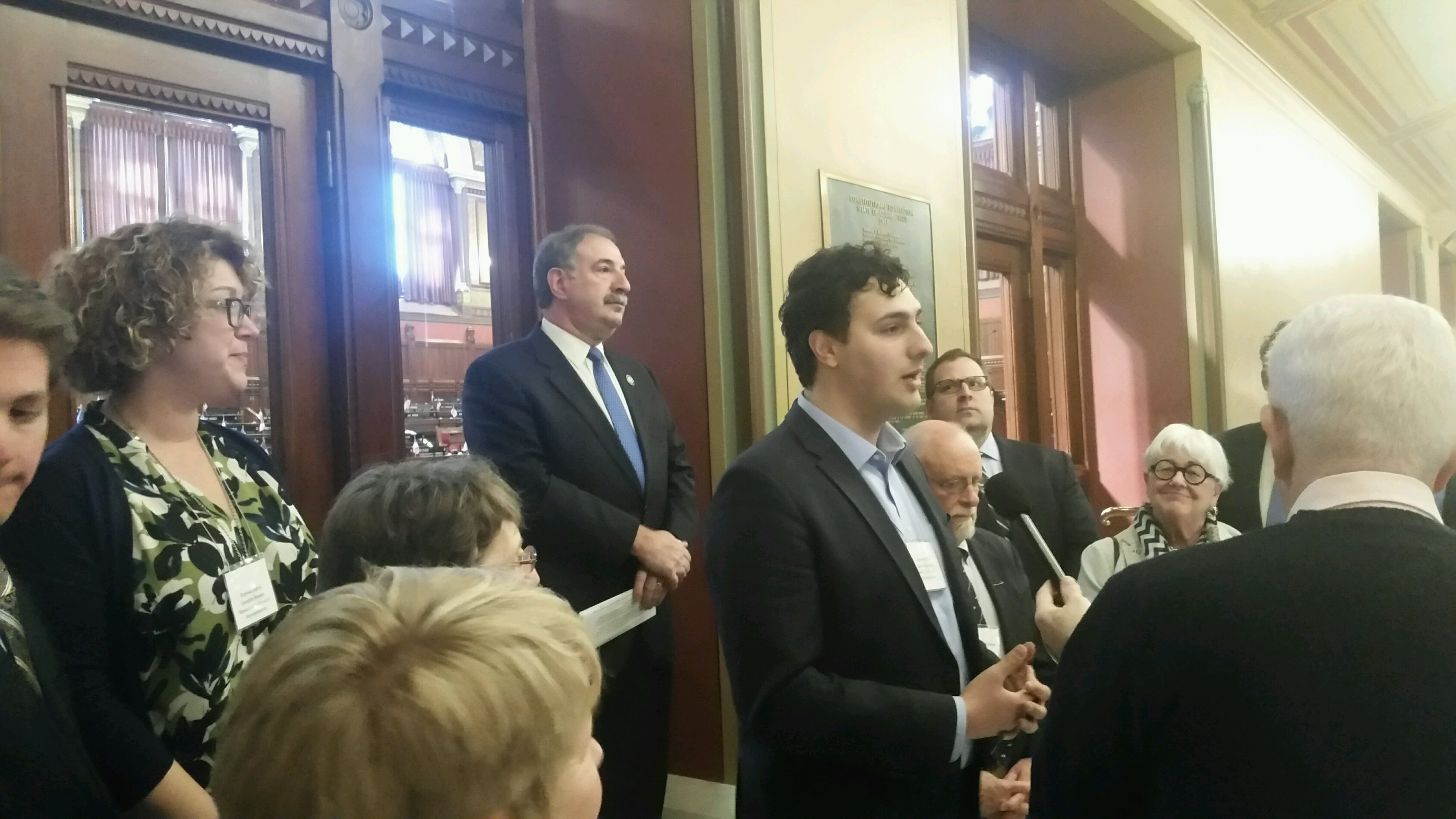 Rhode Island Rep. Aaron Regunberg, D-Providence, speaks at a press conference in Hartford, CT., about the importance of regional cooperation on carbon pricing legislation. Photo by Dave Gerraughty.