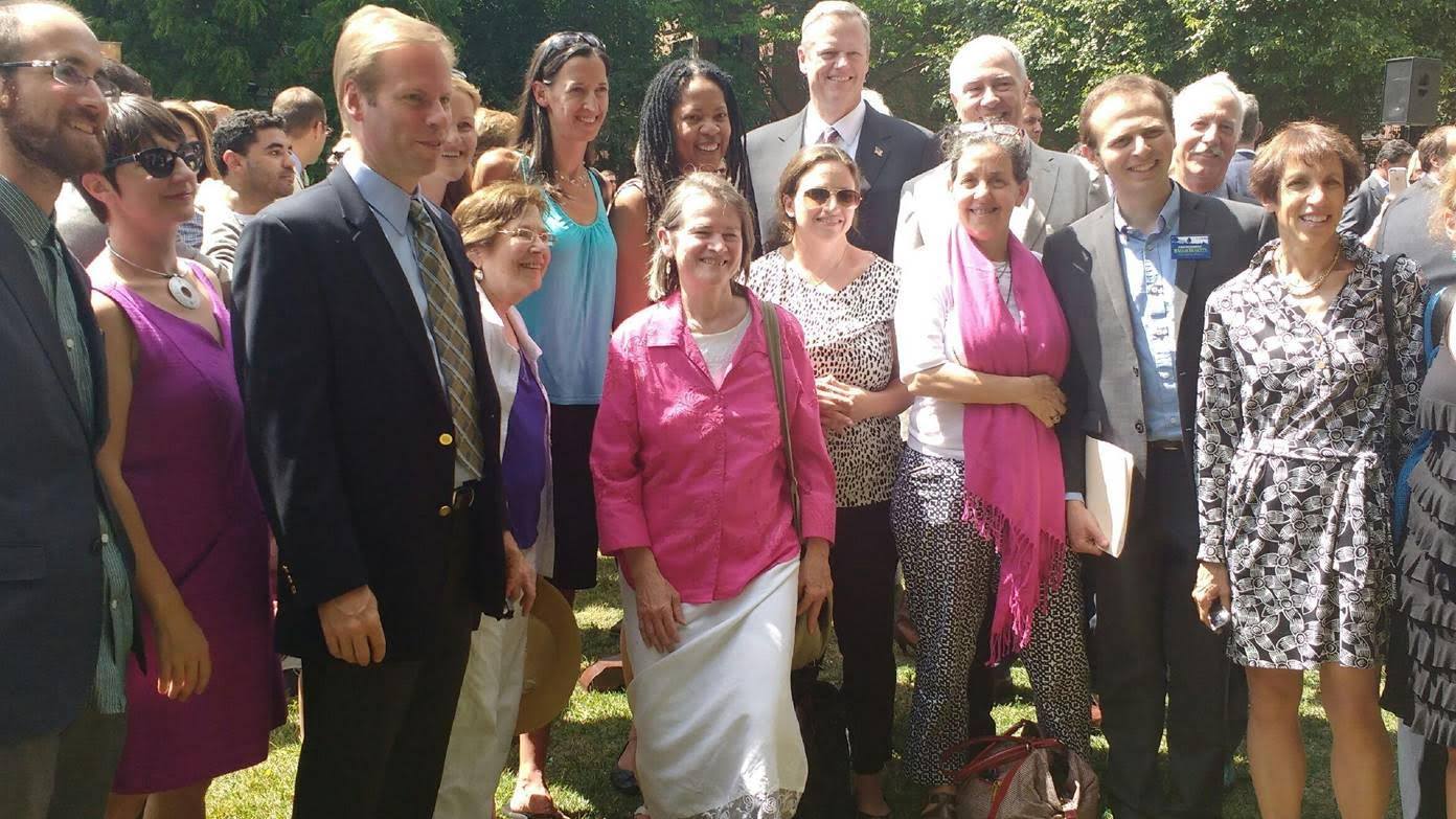 Advocates Pose With Governor At Signing of New Energy Bill