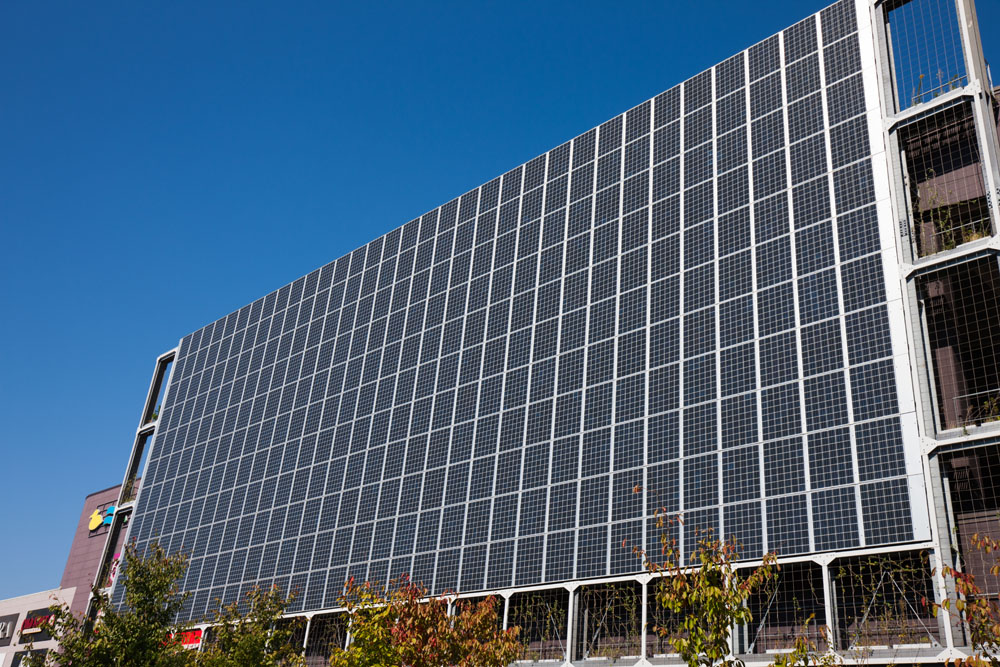 Solar panels on the side of a building. Credit: yoshi0511 / Shutterstock