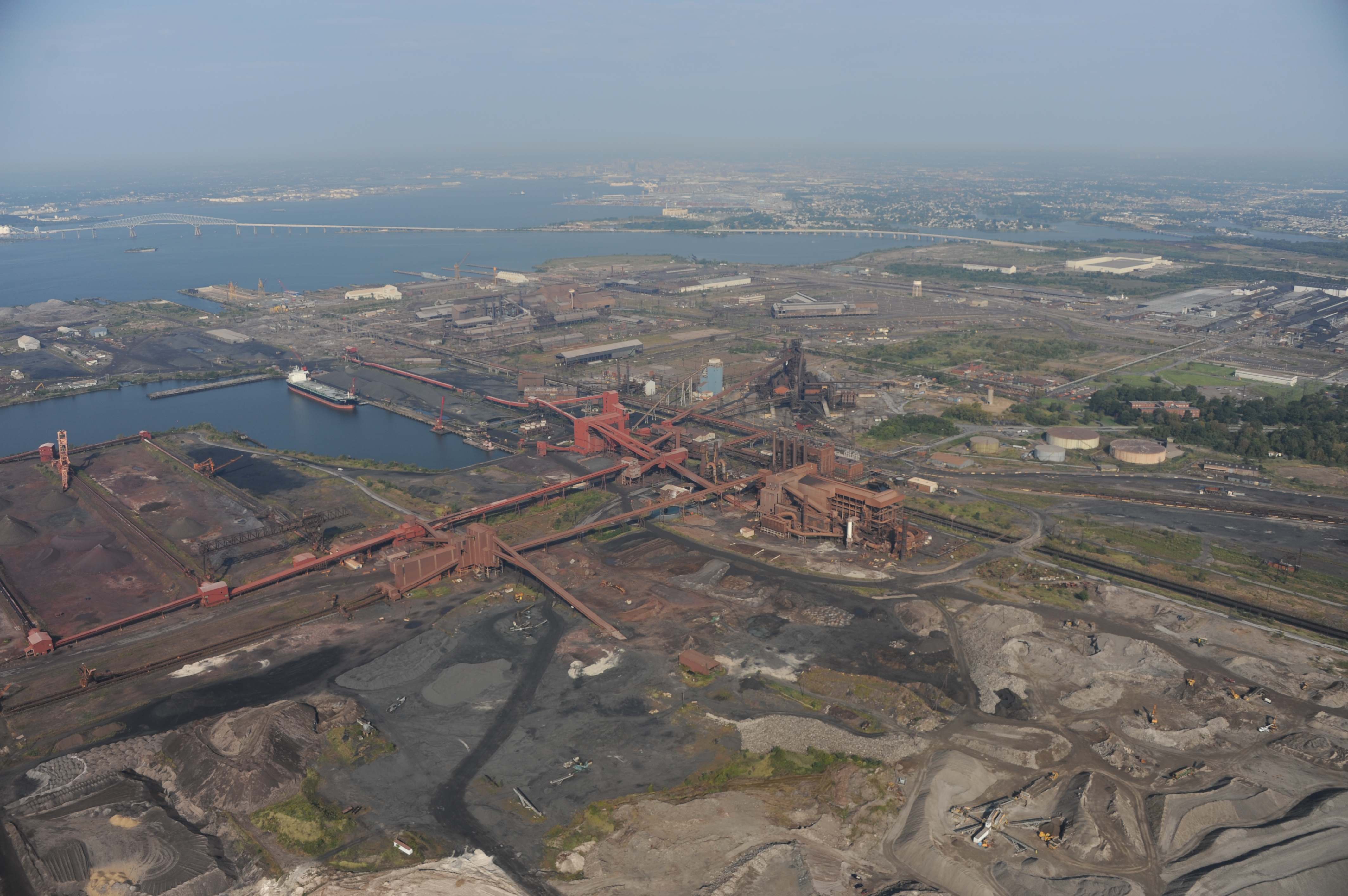 An aerial view of Sparrow's Point in Baltimore County, with the FSK Bridge and Baltimore City in the background.