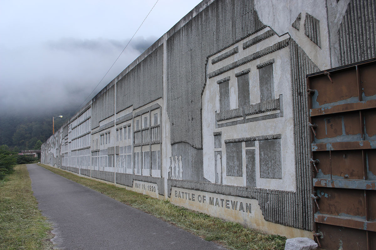 Flood wall in Matewan, WV commemorating the Mine Wars, photo: Neil Bhaerman