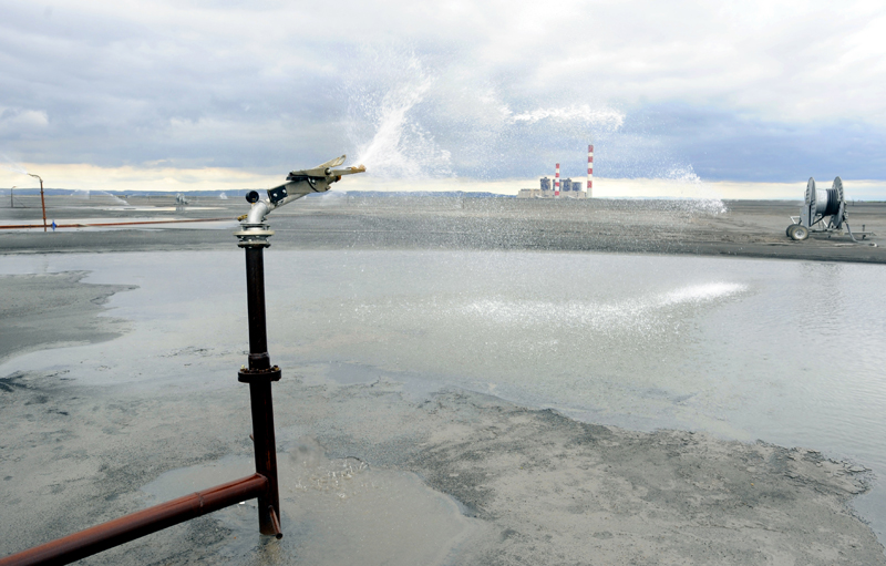 Sprinkler at a coal ash disposal site. Photo credit: bibiphoto / Shutterstock